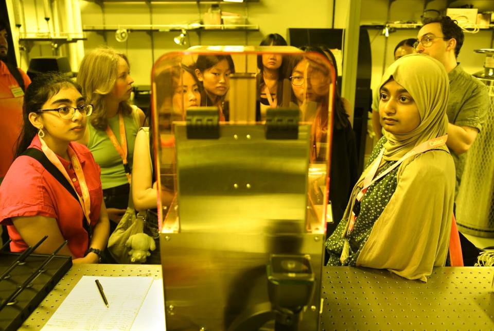 HIgh school girls visit a lab at Caltech