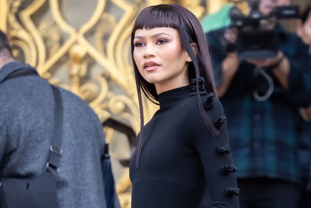 <p>Arnold Jerocki/Getty </p> Zendaya attends the Schiaparelli Haute Couture Spring/Summer 2024 show