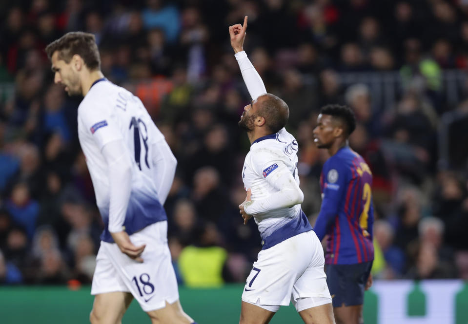 Tottenham midfielder Lucas Moura, center, celebrates after scoring his side's first goal, during the Champions League group B soccer match between FC Barcelona and Tottenham Hotspur, at the Camp Nou stadium, in Barcelona, Spain, Tuesday, Dec. 11, 2018.(AP Photo/Manu Fernandez)