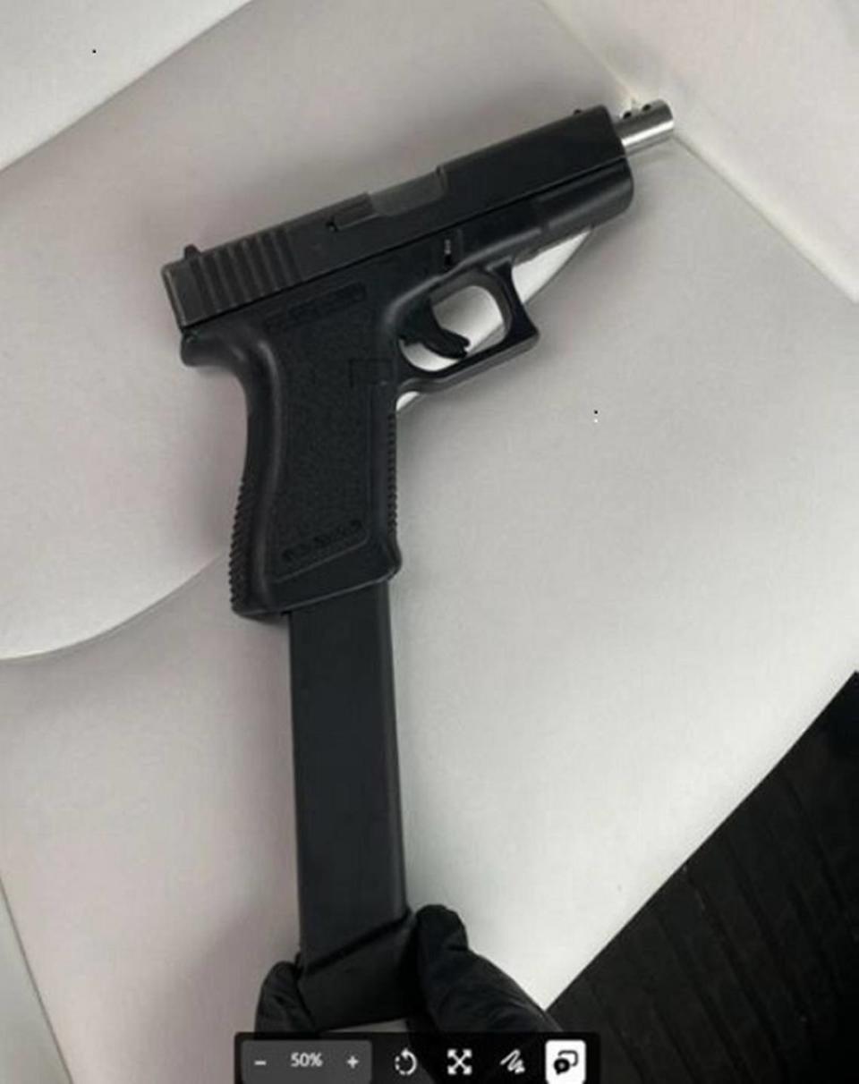 A Glock handgun with an extended magazine was found in a car with a 33-year-old Seattle man who was one of six people federally indicted as part of a drug trafficking ring distributing thousands of fentanyl pills across Whatcom County and the Lummi Nation. U.S. Department of Justice/Courtesy to The Bellingham Herald