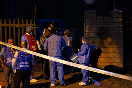 Police investigators collect evidence at a mosque where three men where attacked in Ottawa, South AfricaMay 10, 2018. REUTERS/Rogan Ward