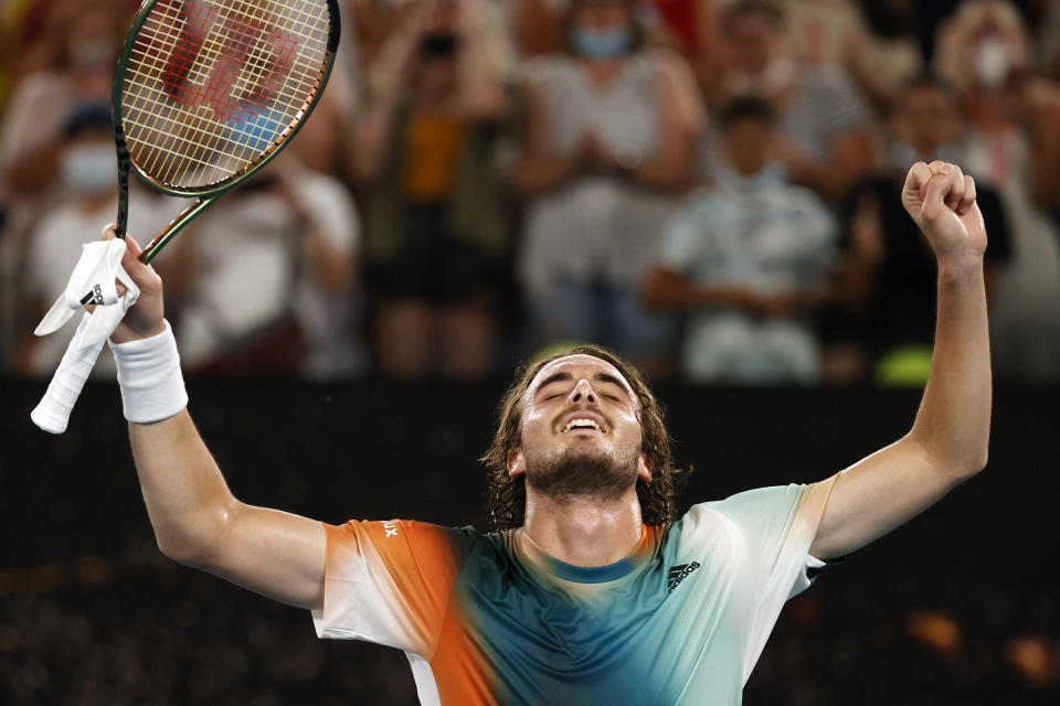 Stefanos Tsitsipas of Greece celebrates after defeating Taylor Fritz of the U.S. in their fourth round match at the Australian Open tennis championships in Melbourne, Australia, early Tuesday, Jan. 25, 2022. (AP Photo/Tertius Pickard)