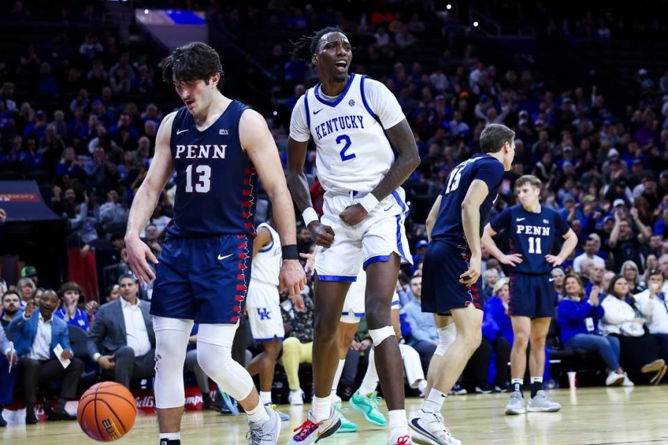 Kentucky forward Aaron Bradshaw (2) celebrates a putback dunk near Penn forward Nick Spinoso (13) during Saturday’s game in Philadelphia.