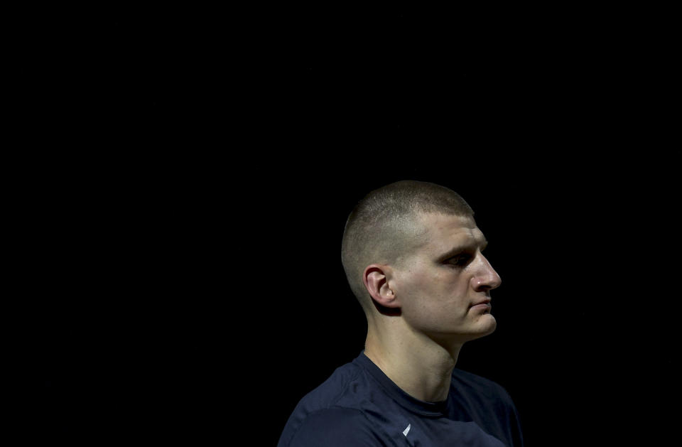 Nikola Jokic (15) of the Denver Nuggets stands on the court with teammates before the first quarter against the Portland Trail Blazers at Ball Arena on Saturday, May 22, 2021. (Photo by AAron Ontiveroz/MediaNews Group/The Denver Post via Getty Images)