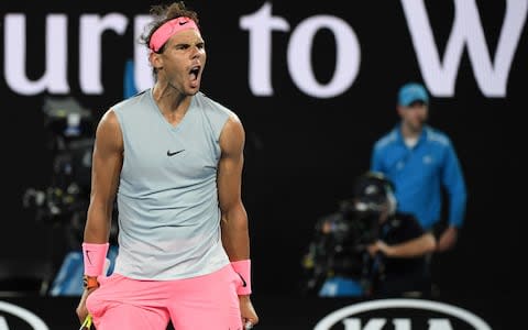 Nadal cheers after winning a point - Credit: AFP