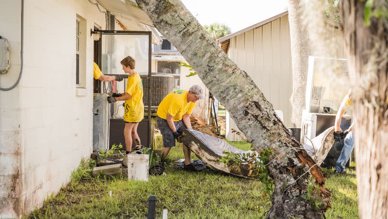 Latter-day Saint volunteers remove waterlogged belongings and muck out a Suwannee, Florida, home in the aftermath of Hurricane Idalia on Saturday, Sept. 2, 2023. Thousands of volunteers from the Church of Jesus Christ came to assist in cleaning up after the storm.