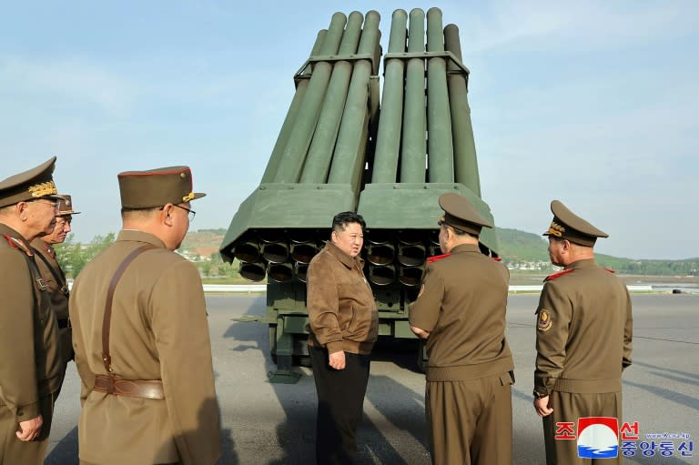 North Korean leader Kim Jong Un inspects the 240mm multiple rocket launcher system at an undisclosed location (STR)