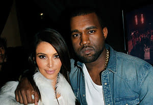 Kim Kardashian and Kanye West | Photo Credits: Eric Ryan/Getty Images