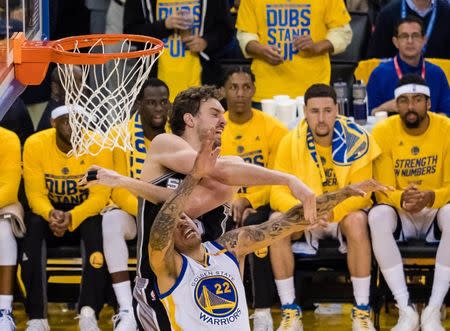 May 14, 2017; Oakland, CA, USA; San Antonio Spurs center Pau Gasol (16) fouls Golden State Warriors forward Matt Barnes (22) on a rebound during the second quarter in game one of the Western conference finals of the 2017 NBA Playoffs at Oracle Arena. Mandatory Credit: Kelley L Cox-USA TODAY Sports