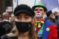 Dancers and theater workers attend a protest against the government restriction measures of closing gyms, cinemas and movie theaters to curb the spread of COVID-19, in front of the Italian Parliament, in Rome, Friday, Oct. 30, 2020. (AP Photo/Alessandra Tarantino)