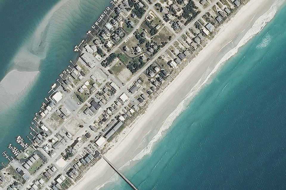 A 2014 aerial image shows larger beaches (National Oceanic and Atmospheric Administration)