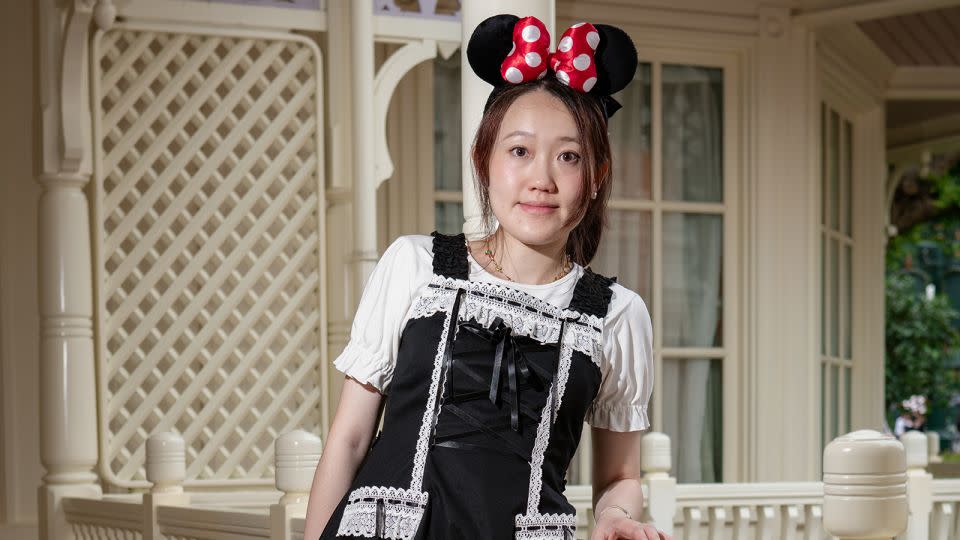 Shen Jing, 33, is celebrating her pregnancy at Disney. “I want to show the baby (what it’s like),” said the Taobao online store operator from Hangzhou, China. “I like the atmosphere, it’s relaxing.” - Noemi Cassanelli/CNN