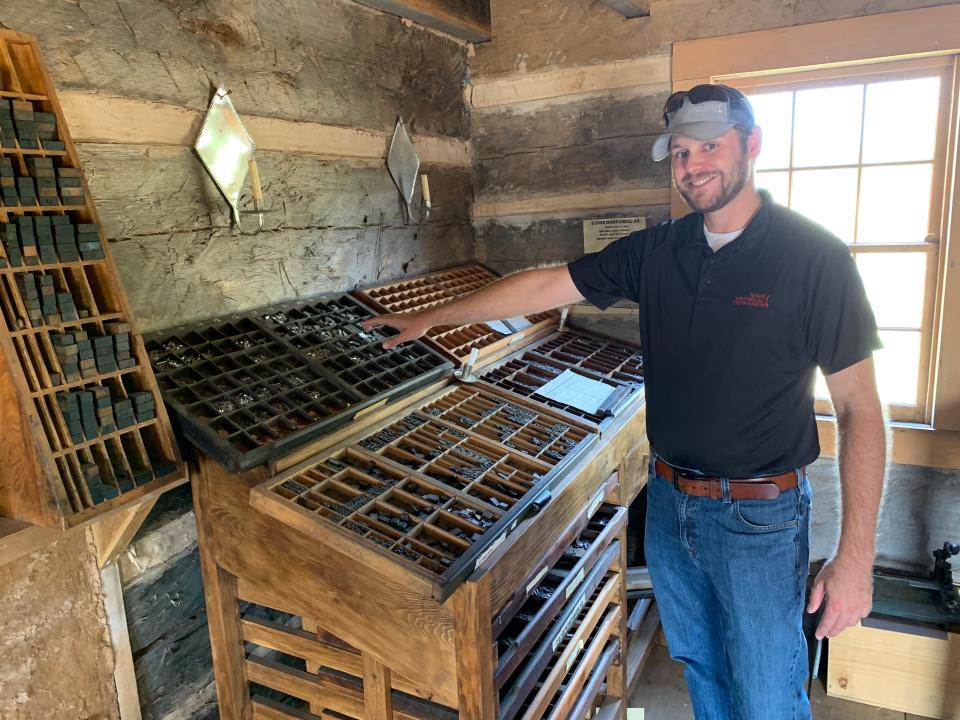 Jordan Anderson, assistant site manger, demonstrates how the newspaper in San Felipe de Austin was typeset. Visitors can watch the printing process with a vintage press.