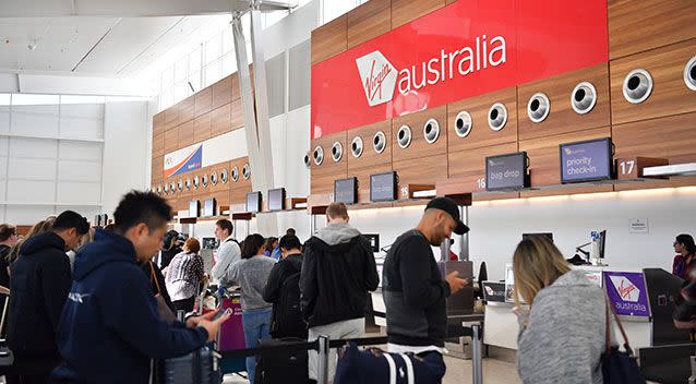 Virgin Australia is manually checking in passengers after a technical issue took its computer check-in system offline.  Picture: AAP/Morgan Sette
