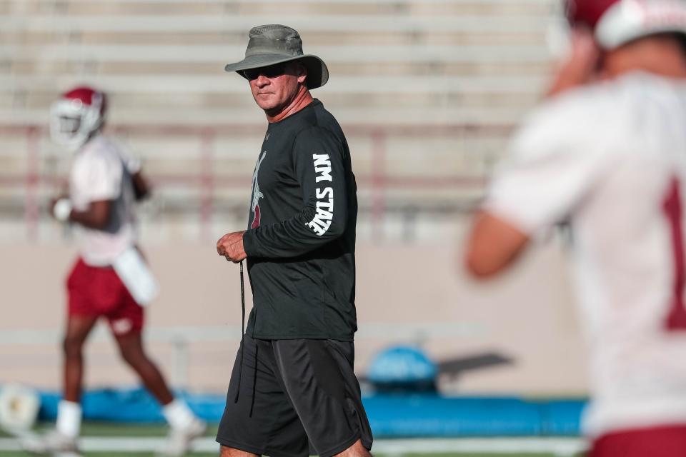 Head coach Doug Martin runs drills at New Mexico State University's first practice of the year in Aggie Memorial Stadium on Friday, Aug 2, 2019.