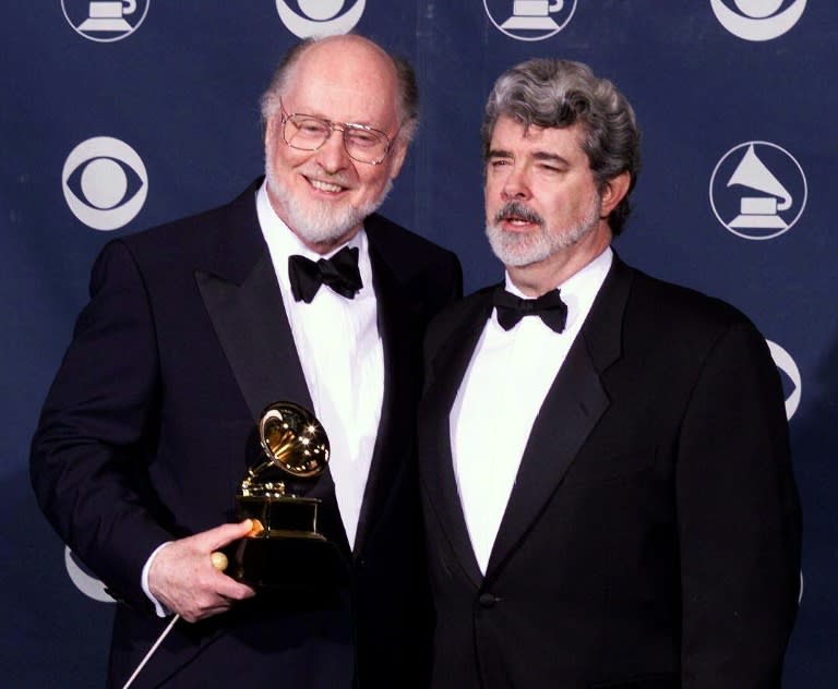 Filmmaker George Lucas (R) and composer John Williams, who won a Grammy for Best Instrumental Composition Written for a Motion Picture for the film "Saving Private Ryan", at the 41st Grammy Awards in Los Angeles in February 1999