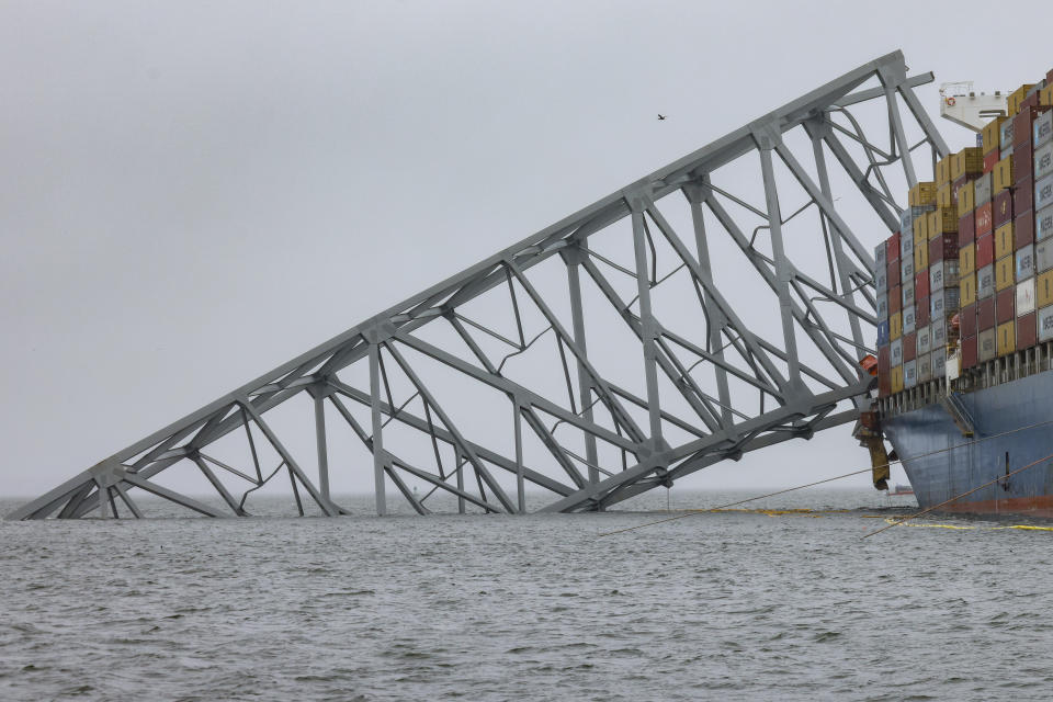 Wreckage of the Francis Scott Key Bridge rests on the container ship Dali, Wednesday, April 3, 2024, in Baltimore. (AP Photo/Julia Nikhinson)