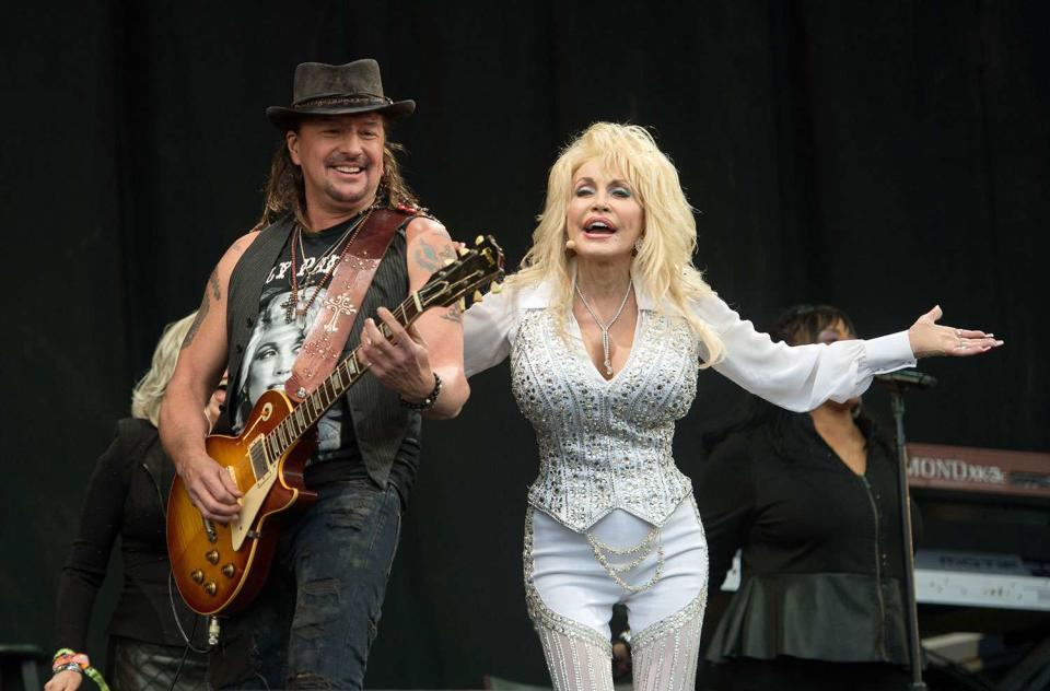 <p>Samir Hussein/Redferns</p> Richie Sambora and Dolly Parton perform at Glastonbury in June 2014