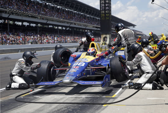 <p>The car driven by Alexander Rossi is serviced during a pit stop in the 100th running of the Indianapolis 500 auto race at Indianapolis Motor Speedway in Indianapolis, Sunday, May 29, 2016. <em>(AP Photo/Rob Baker)</em> </p>