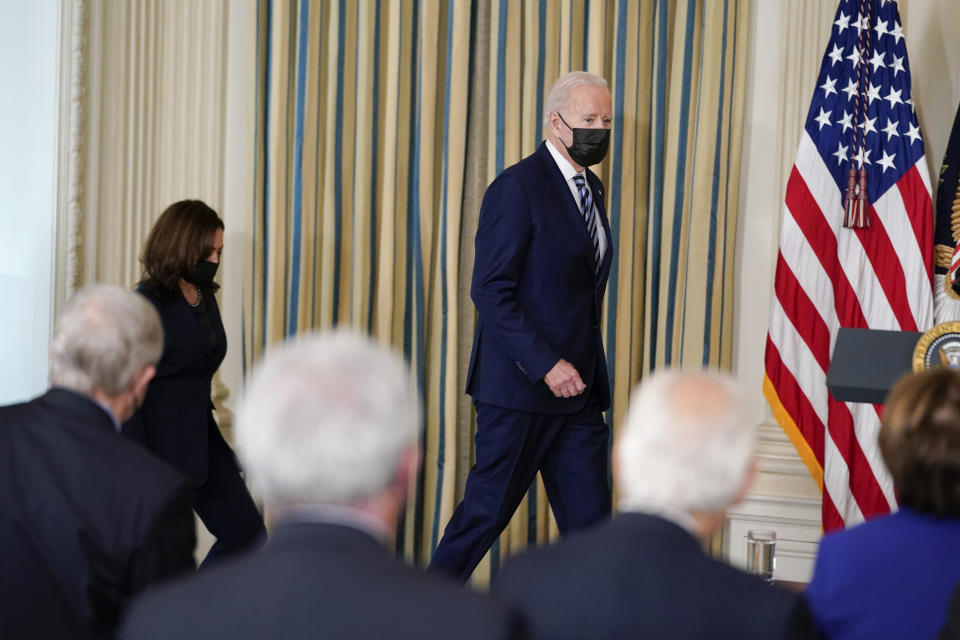 FILE - President Joe Biden arrives with Vice President Kamala Harris to speak before signing into law S. 1511, the "Protecting America's First Responders Act of 2021," S. 1502, the "Confidentiality Opportunities for Peer Support Counseling Act or the COPS Counseling Act," and S. 921, the "Jaime Zapata and Victor Avila Federal Officers and Employees Protection Act," in the State Dining Room of the White House, Thursday, Nov. 18, 2021, in Washington. Biden is headed to Walter Reed National Military Medical Center for his first routine physical as president. White House press secretary Jen Psaki announced the trip in a tweet early Friday. (AP Photo/Evan Vucci)