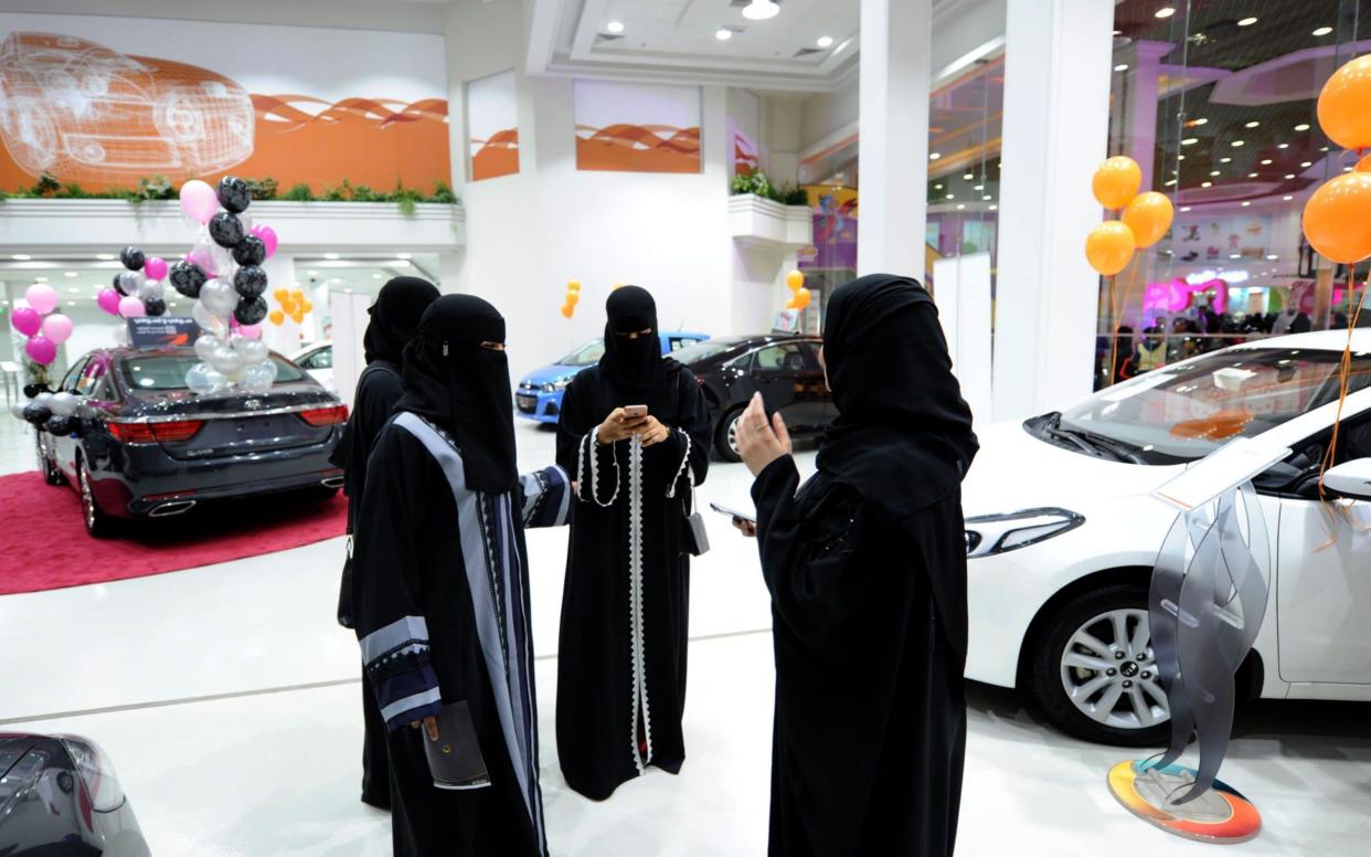 Saudi women tour a car showroom for women on January 11, 2018, in the Saudi Red Sea port city of Jeddah. - AFP
