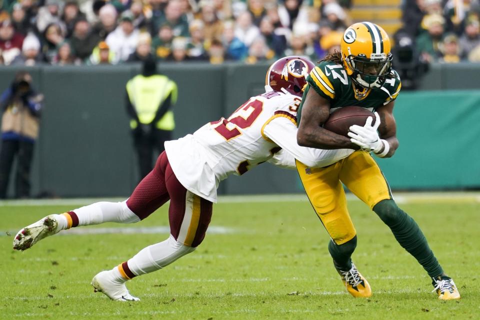 Green Bay Packers' Davante Adams tries to get past Washington Redskins' Jimmy Moreland during the second half of an NFL football game Sunday, Dec. 8, 2019, in Green Bay, Wis. (AP Photo/Morry Gash)