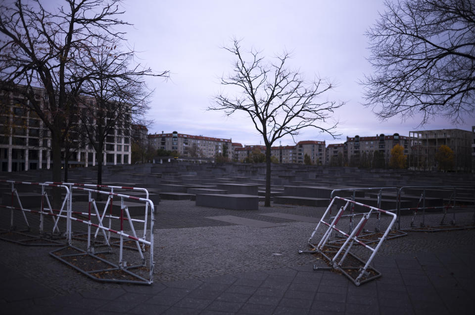 Protecting barriers set up around the Memorial to the Murdered Jews of Europe, known as Holocaust Memorial on the 85th anniversary of the November 1938 pogroms in Germany and Austria, in central Berlin, Germany, Thursday, Nov. 9, 2023. According to Israel's Yad Vashem Holocaust memorial, the Nazis killed at least 91 people, vandalized 7,500 Jewish businesses and burned more than 1,400 synagogues during Nov. 9, 1938, pogroms known as Kristallnacht, or "Night of broken Glass." (AP Photo/Markus Schreiber)