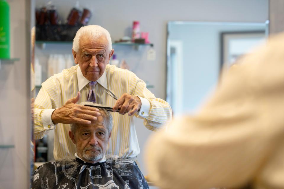Tony Tamburello, owner, cuts the hair of Tony Amodio of Interlaken at Allenhurst Station Salon in Allenhurst, NJ Wednesday, June 8, 2022. 