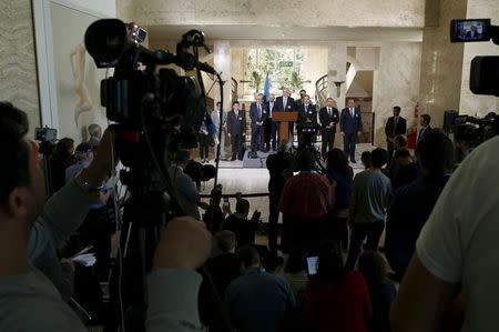 Syrian government's head of delegation Bashar Ja'afari attends with other members a news conference after a meeting on Syria at the United Nations in Geneva, Switzerland, April 22, 2016. REUTERS/Denis Balibouse