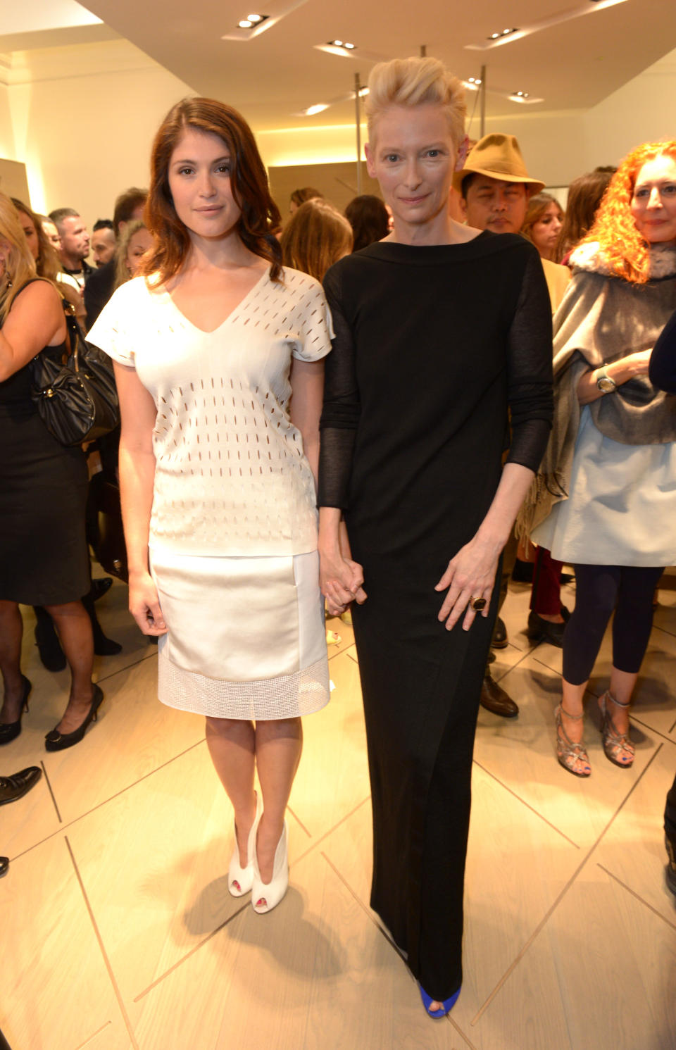 Gemma Arterton, left, and Tilda Swinton pose for photographers at the Pringle of Scotland Store Launch Party during London Fashion Week in London on Monday, Sept. 16, 2013. (Photo by Jon Furniss/Invision/AP)