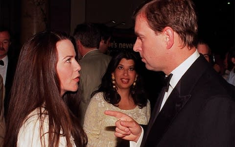 Britain's Prince Andrew chats to his old flame, American photographer and former actress Koo Stark - Credit: AP