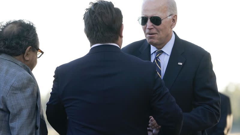 President Joe Biden greets Rep. Ruben Gallego, D-Ariz., and Rep. Raul Grijalva, D-Ariz., as he arrives on Air Force One at Grand Canyon National Park Airport, Monday, Aug. 7, 2023, in Grand Canyon Village, Ariz. 