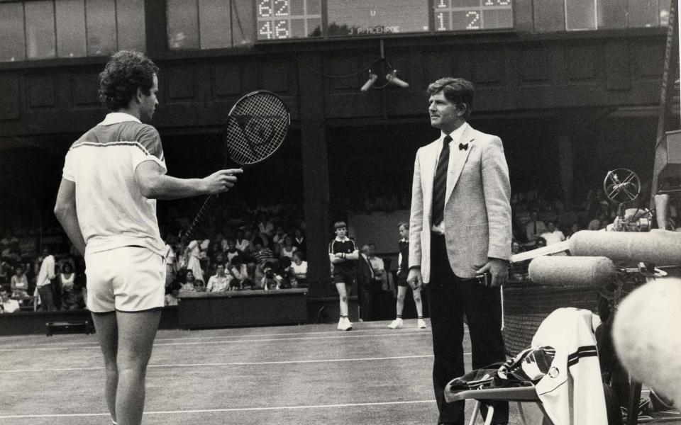 John McEnroe argues with Wimbledon referee Alan Mills during the 1983 Championships