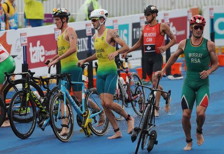 Triathlon - Gold Coast 2018 Commonwealth Games - Men's Final - Southport Broadwater Parklands - Gold Coast, Australia - April 5, 2018 - (From L) Luke Willian of Australia, Jacob Birtwhistle of Australia, Tyler Mislawchuk of Canada and Richard Murray of South Africa. REUTERS/Athit Perawongmetha