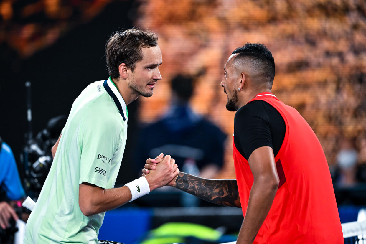 Daniil Medvedev of Russia shakes hands with Nick Kyrgios of Australia after beating him during day four of the 2022 Australian Open.