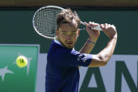 Daniil Medvedev, of Russia, returns a shot to Tomas Machac, of the Czech Republic, at the BNP Paribas Open tennis tournament Saturday, March 12, 2022, in Indian Wells, Calif. (AP Photo/Marcio Jose Sanchez)