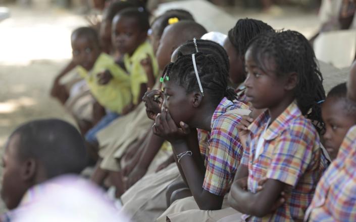 El Roi Academy students attend a press conference to demand the freedom of New Hampshire nurse Alix Dorsainvil and her daughter, who have been reported kidnapped, in the Cite Soleil neighborhood of Port-au-Prince, Haiti