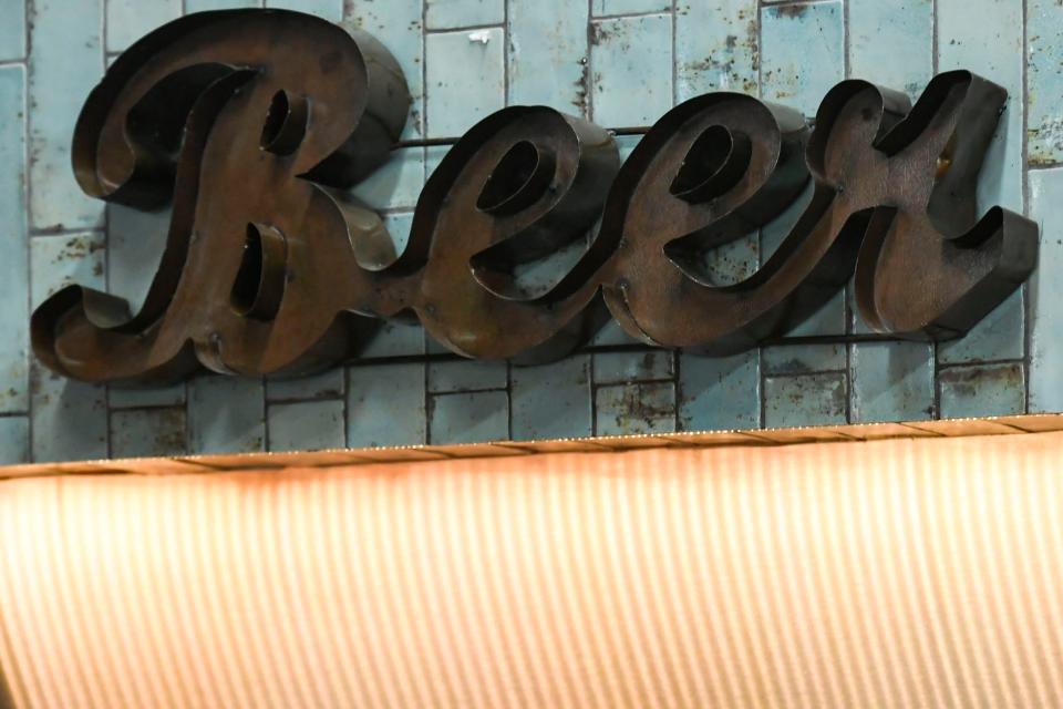 An old beer sign hangs over the tap wall at Main Street Pub in Spartanburg, S.C., on Wednesday, April 10, 2024. The sign is one of few items that was saved from the remodel.