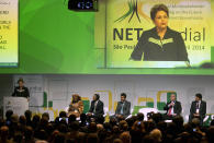 Brazil's President Dilma Rousseff addresses the opening ceremony of NETmundial, a major conference on the future of Internet governance in Sao Paulo, Brazil, Wednesday, April 23, 2014. Rousseff ratified a bill guaranteeing Internet privacy and enshrining access to the Web during the conference. The legislation, which was passed by the Senate late Tuesday, puts limits on the metadata that can be collected from Internet users in Brazil. It also makes Internet service providers not liable for content published by their users and requires them to comply with court orders to remove offensive material. (AP Photo/Andre Penner)