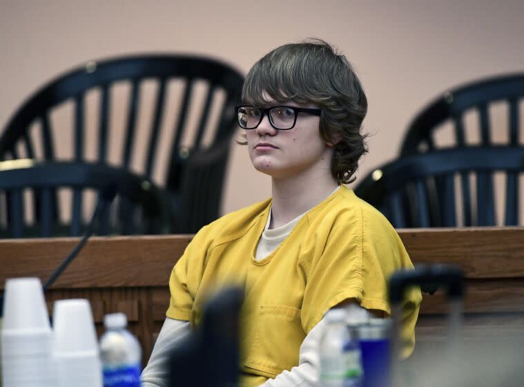 FILE - Jesse Osborne waits for a ruling at the Anderson County Courthouse, Feb. 16, 2018, in Anderson, S.C.. Osborne, a school shooter serving a life sentence without parole for killing a first grader on a South Carolina playground when he was 14 is asking a judge to lessen his sentence so he can eventually get out of prison. On Monday, May 22, 2023, Osborne's lawyer asked Judge Lawton McIntosh to reconsider his sentence so Osborne, now 21, could have some hope of freedom in his late 50s or even 60s. (Ken Ruinard/The Independent-Mail via AP, Pool, File)