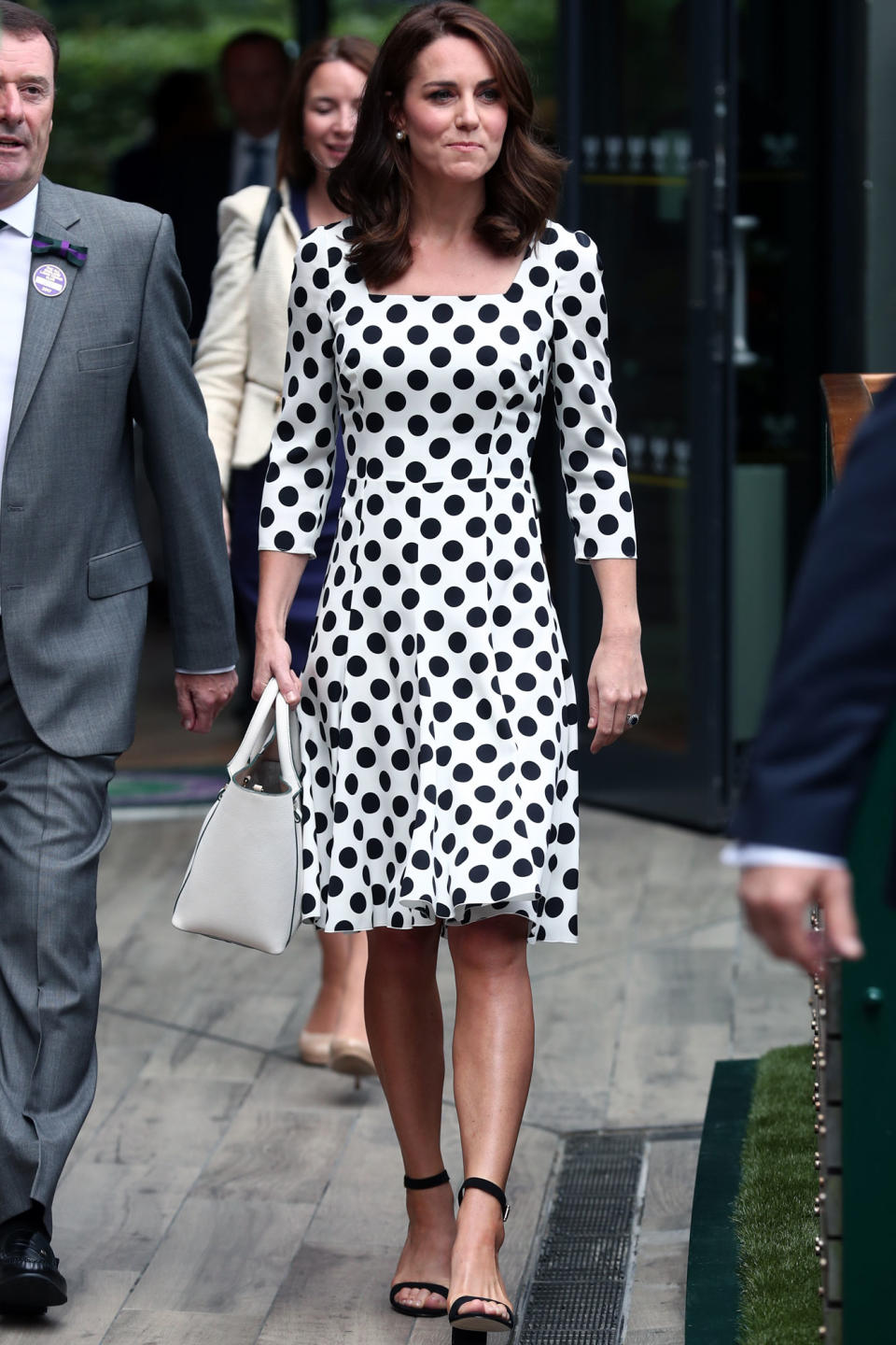 <p>The royal mom wore a <span>polka dot Dolce & Gabbana dress</span> as she headed to the iconic sports arena in London before the first match of the day. <strong>Get the look! </strong>Adrianna Papell Short-Sleeve Polka Dot Dress, $120; <span>bloomingdales.com</span></p>