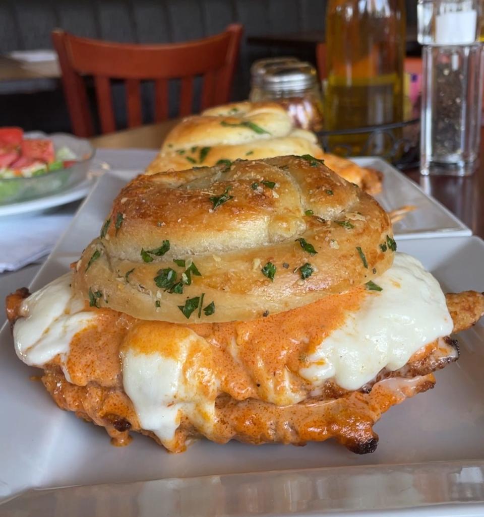 A chicken parm sub on a giant garlic knot at Positano Restaurant.