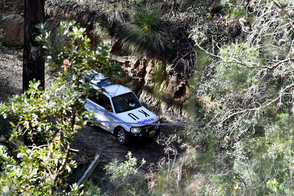 A police van is seen near where a woman's body was discovered in North Wahroonga, Sydney, Friday, July 15, 2022. 