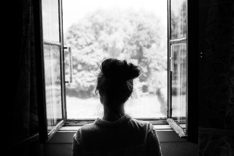 <span class="caption">Social distancing has cut asylum seekers off from networks of support.</span> <span class="attribution"><a class="link " href="https://www.shutterstock.com/image-photo/woman-looking-through-old-window-on-211654111" rel="nofollow noopener" target="_blank" data-ylk="slk:Jan Faukner/Shutterstock;elm:context_link;itc:0;sec:content-canvas">Jan Faukner/Shutterstock</a></span>