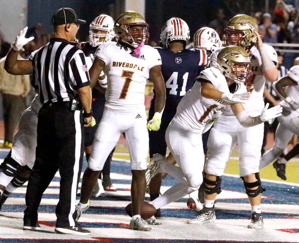 Riverdale's Braylen Vanderbilt (7) and Riverdale's Ben Woodruff (13) celebrate pulling ahead of Oakland with a 2 point conversion in the final minutes the Battle of the Boro football game at Oakland on Friday, Oct. 27, 2023.