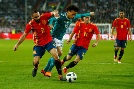 Soccer Football - International Friendly - Germany vs Spain - ESPRIT arena, Dusseldorf, Germany - March 23, 2018 Germany’s Leroy Sane in action with Spain’s Dani Carvajal and Lucas Vazquez REUTERS/Thilo Schmuelgen