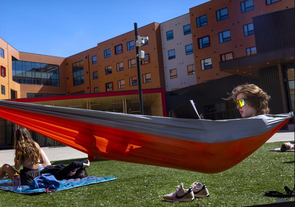 First-year student Kieran Griffin reads in the courtyard of Kahlert Village at the University of Utah in Salt Lake City on Wednesday, April 26, 2023. | Laura Seitz, Deseret News