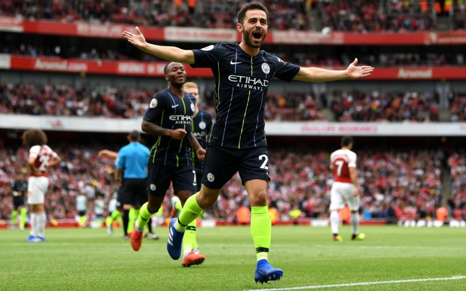 Bernardo Silva of Manchester City celebrates scoring his team's second goal during the Premier League match between Arsenal FC and Manchester City - Getty Images Europe