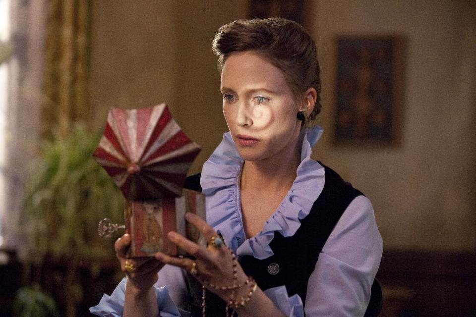 In this publicity image released by Warner Bros. Pictures, Vera Farmiga portrays Lorraine Warren in a scene from "The Conjuring." (AP Photo/New Line Cinema/Warner Bros. Pictures, Michael Tacket, Filet)