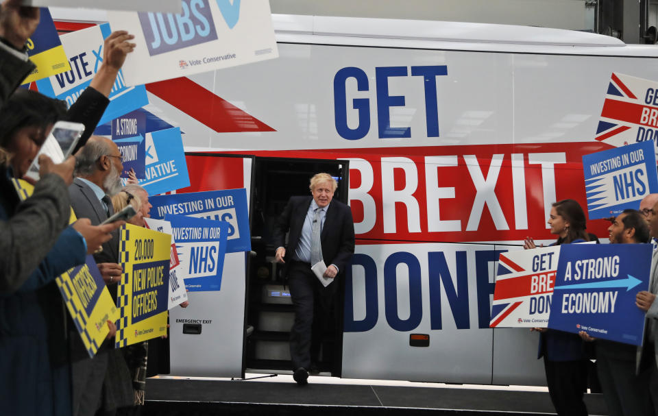 FILE - Britain's Prime Minister Boris Johnson addresses his supporters prior to boarding his General Election campaign trail bus in Manchester, England, Friday, Nov. 15, 2019. He was the mayor who reveled in the glory of hosting the 2012 London Olympics, and the man who led the Conservatives to a whopping election victory on the back of his mission to “get Brexit done.” But Boris Johnson’s time as prime minister was marred by his handling of the coronavirus pandemic and a steady stream of ethics allegations. (AP Photo/Frank Augstein, Pool, File)